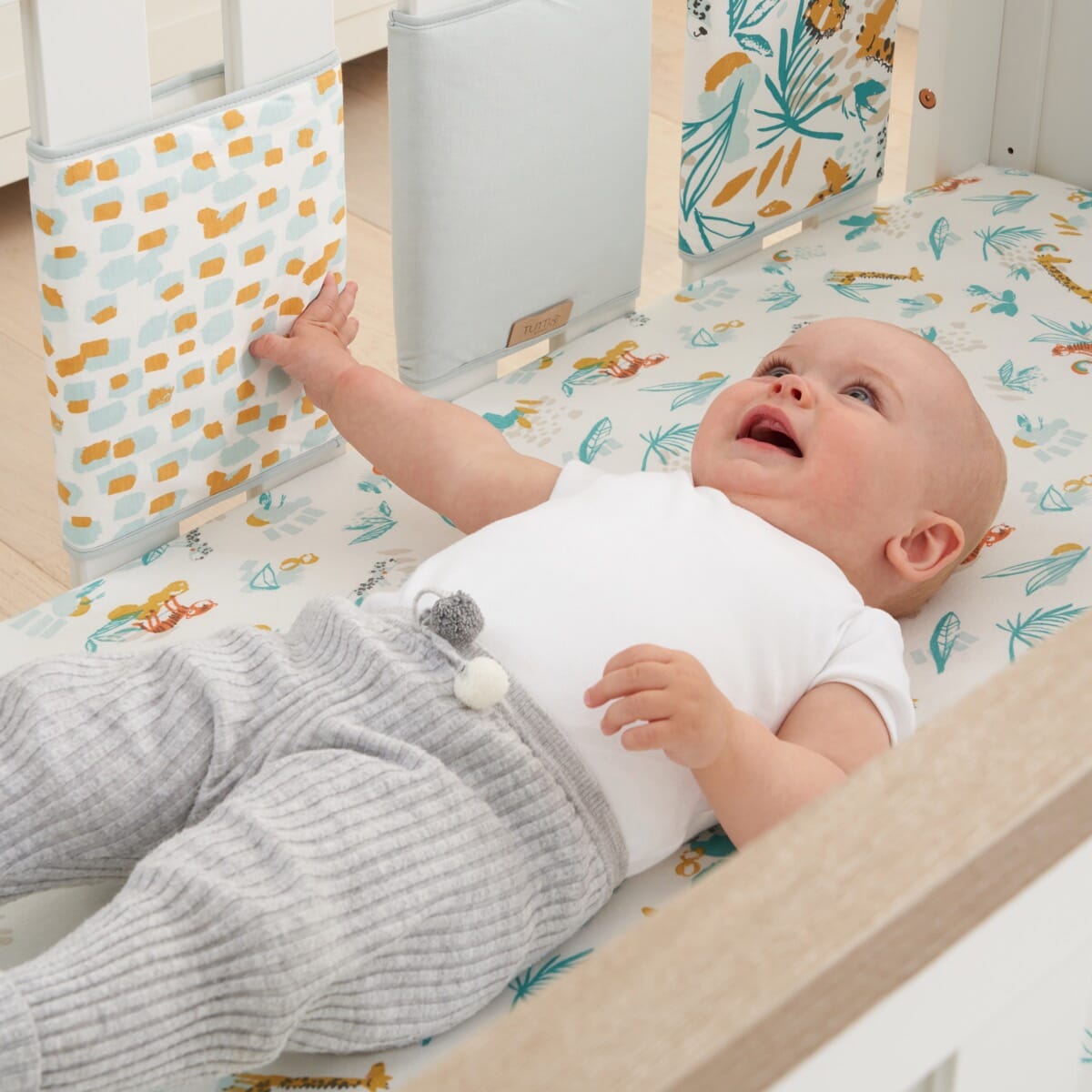 Baby banging outlet head on cot