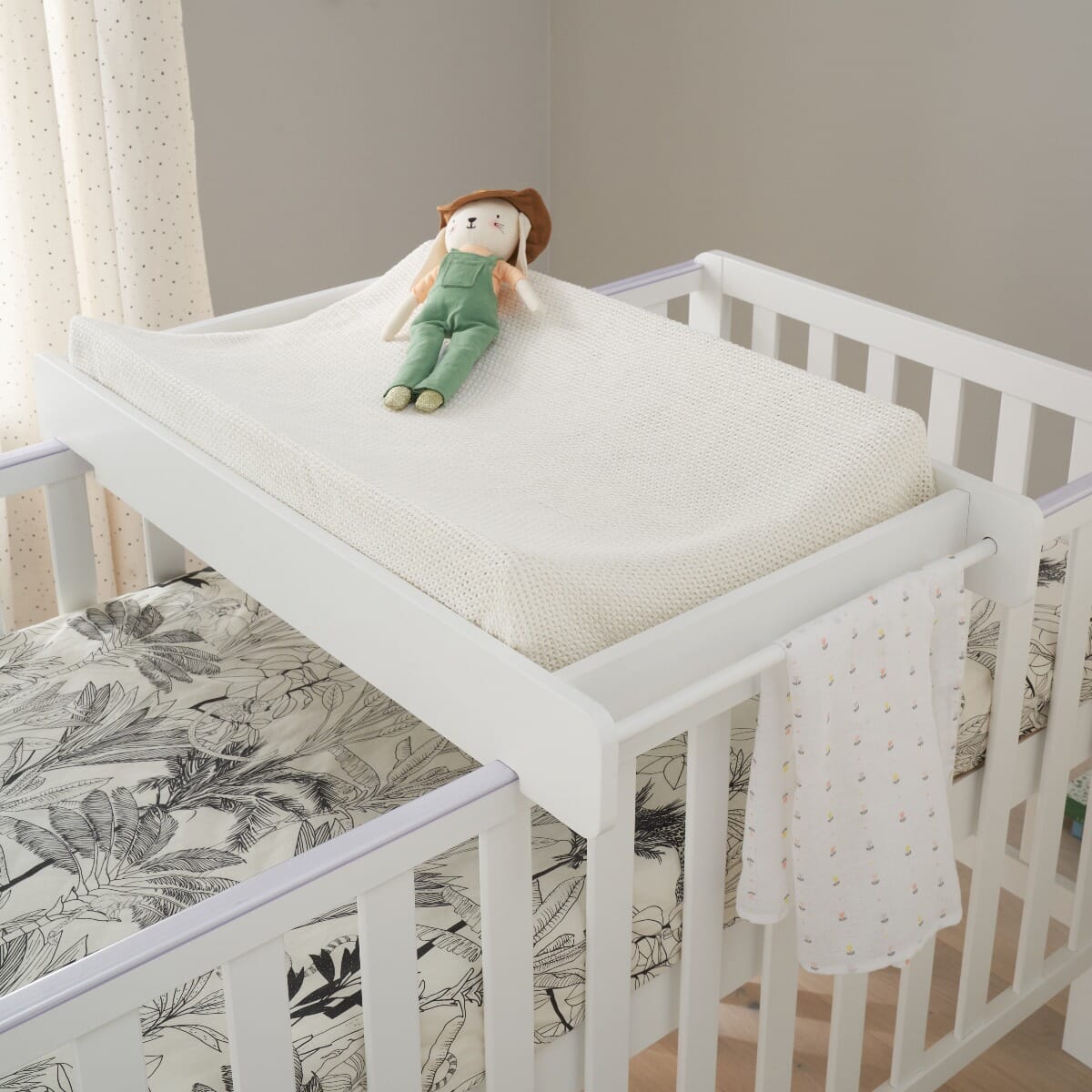 Crib with clearance changing table